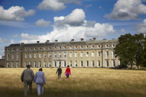 Visitors at the West front of Petworth House, West Sussex.