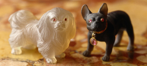 A close-up of two miniature Faberge dogs from the Drawing Room at Polesden Lacey, nr Dorking, Surrey