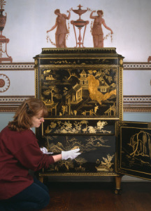A lady's secretaire attributed to Thomas Chippendale (1718-1779), veneered with black and gold Chinese lacquer, with additional English japanning and gilding, c. 1775 at Osterley