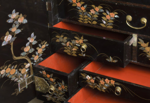 Drawers open inside the Japanese lacquer cabinet, c.1630, on English stand in the form of putti, c.1670, in the Green Closet at Ham House, Kingston-upon-Thames.