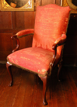 Queen Anne large mahogany frame state chair; stuffed seat, back and arms upholstered in old crimson silk damask; cabriole legs. The damask and fringe apparently applied over cherry coloured velvet. 'Freyer July 1783' written in ink inside stretcher.