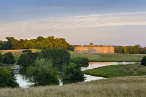 The house and upper pond at Petworth House and Park, West Sussex. Credit National Trust Images, Andrew Butler.