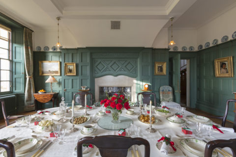 The dining table, decorated and set for Christmas dinner, in the Dining Room at Standen House and Garden, West Sussex. ©National Trust Images/Chris Lacey
