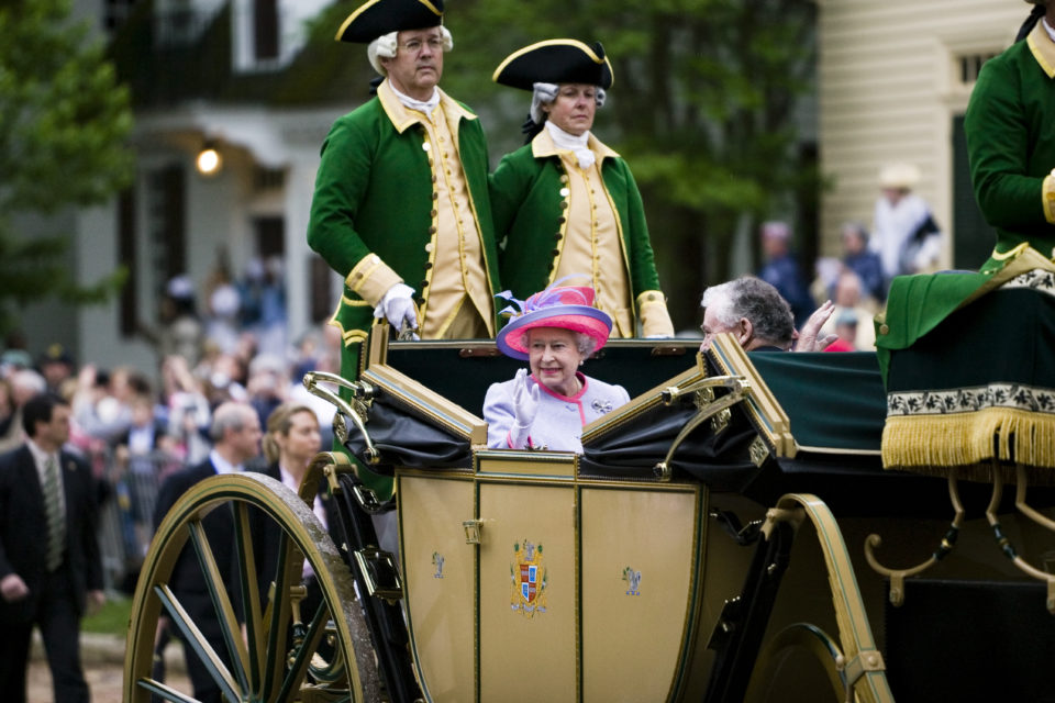 Queen Elizabeth II waving to crowds on a carriage ride in Colonial Williamsburg, 2007