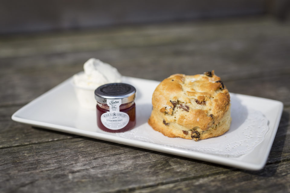A fruit scone, jam and clotted cream at Dunham Massey, Cheshire. ©National Trust Images/Rob Stothard