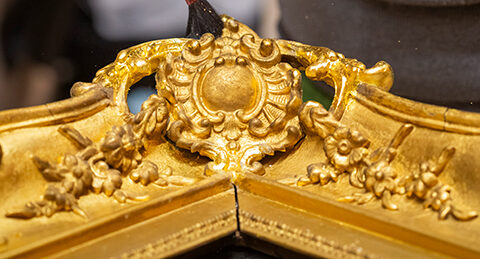 Gold leaf being added to the frame by Julieta Herrera at The Royal Oak Foundation Conservation Studio