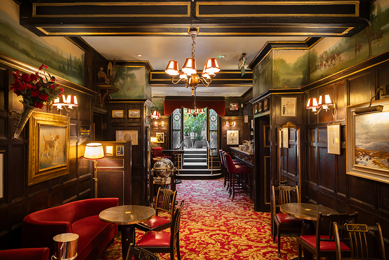 View through the cocktail bar to the winter garden at Rules Restaurant in Covent Garden London © National Trust Images /Megan Taylor